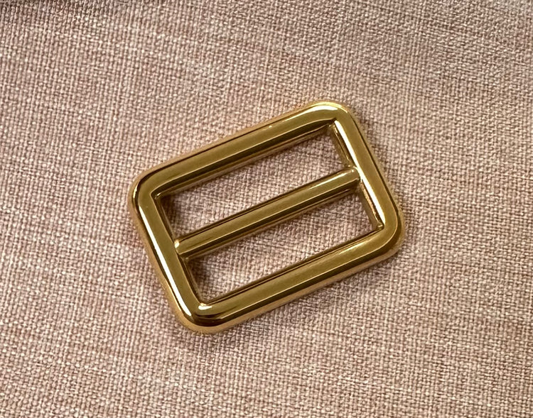24k gold-plated tri-glide buckle slider - 25mm in gold