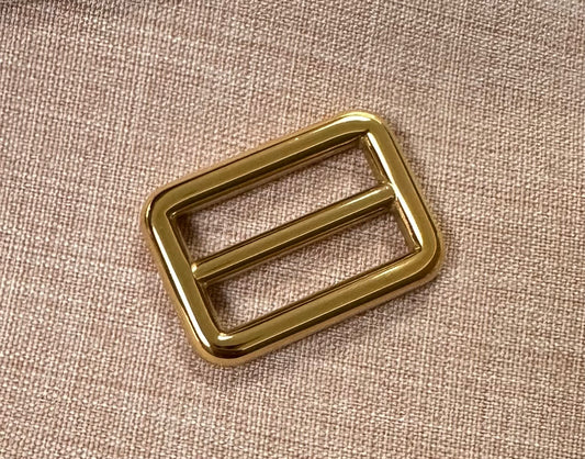 24k gold-plated tri-glide buckle slider - 25mm in gold